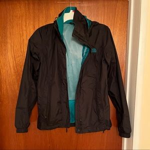 Black and blue north face rain coat